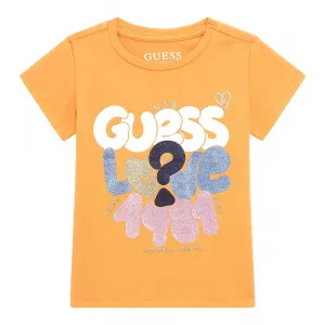 Оранжева тениска с къс ръкав с цветни надписи и глитери за момиче Guess