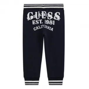 Спортен панталон в тъмно синьо за мини момче с бели надписи Guess